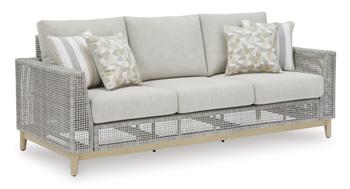 Ashley Furniture Seton Creek outdoor seating set with cushioned chairs and table, perfect for patio relaxation.