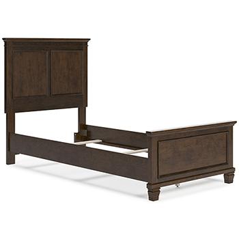 Ashley Furniture Danabrin Bed with a modern wooden frame and neutral-toned headboard in a bedroom setting