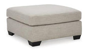 Mahoney Ashley Furniture oversized accent ottoman with plush fabric, serving as a stylish, versatile living room accent piece.