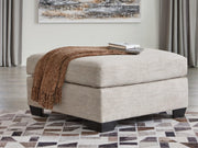 Oversized Ashley Furniture Mahoney accent ottoman with plush fabric and stylish design, perfect for living room decor.
