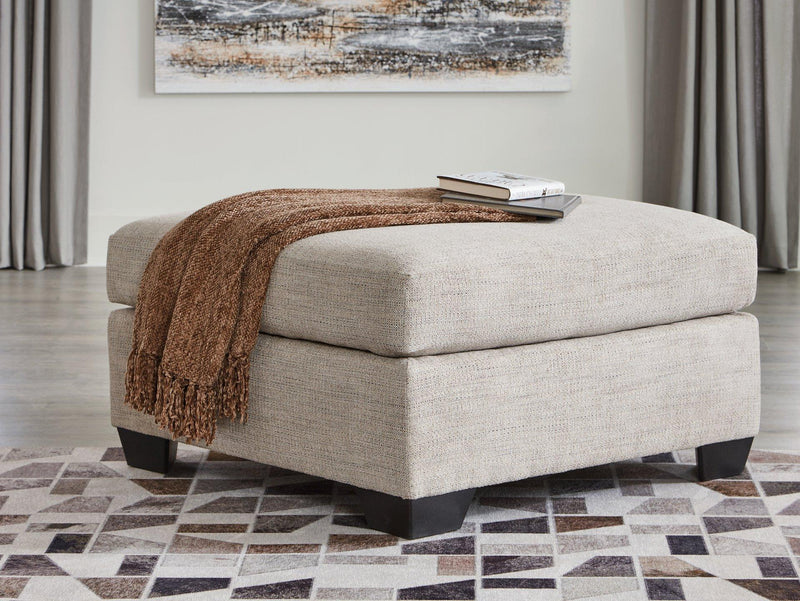Oversized Ashley Furniture Mahoney accent ottoman with plush fabric and stylish design, perfect for living room decor.