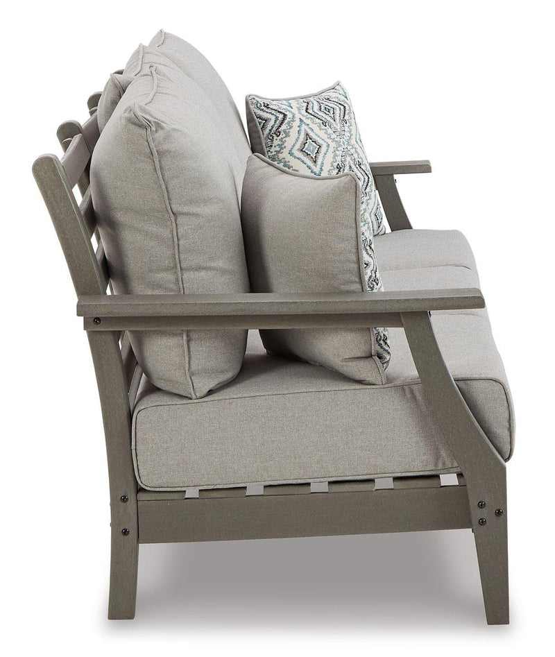 Ashley Furniture Visola outdoor seating set featuring a sofa, loveseat, and coffee table with weather-resistant cushions and stylish design.