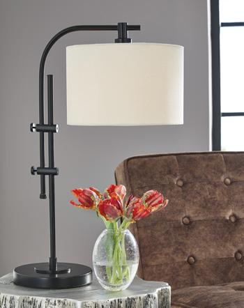 Set of two Ashley Furniture Baronvale Lamps with beige fabric shades and wooden bases, perfect for bedroom or living room decor.