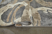 Ashley Furniture Faelyn 7'10" x 9'10" rug with intricate patterns in neutral tones, ideal for living room or bedroom decor.