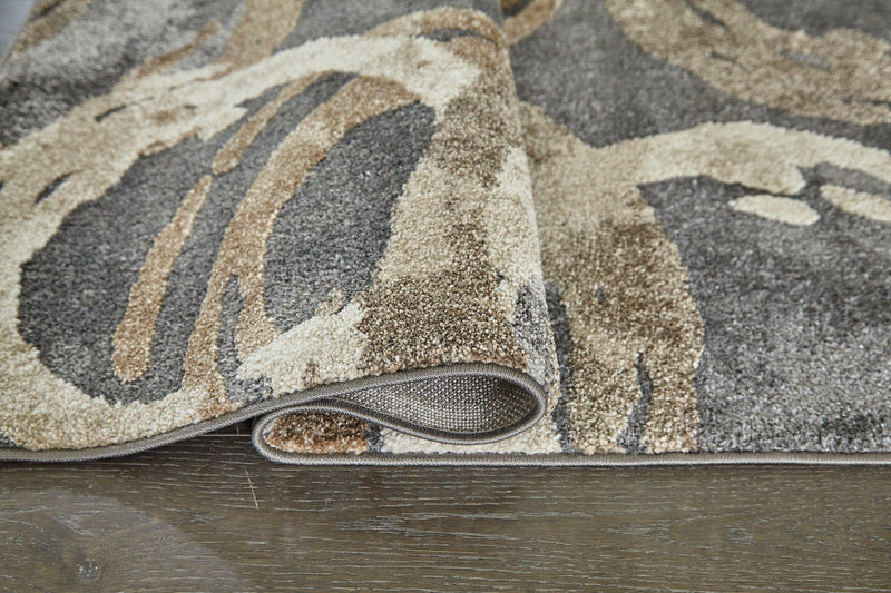 Ashley Furniture Faelyn 7'10" x 9'10" rug with intricate patterns in neutral tones, ideal for living room or bedroom decor.
