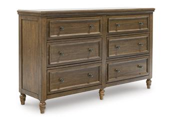 Ashley Furniture Sturlayne dresser with attached mirror, showcasing a modern wooden bedroom storage unit with a sleek design.