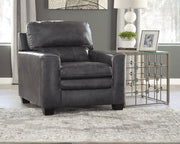 South 8' x 10' rug from Ashley Furniture featuring a plush, patterned design in neutral tones on a wooden floor.