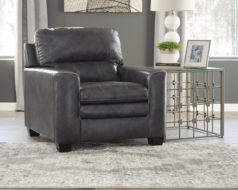 South 8' x 10' rug from Ashley Furniture featuring a plush, patterned design in neutral tones on a wooden floor.
