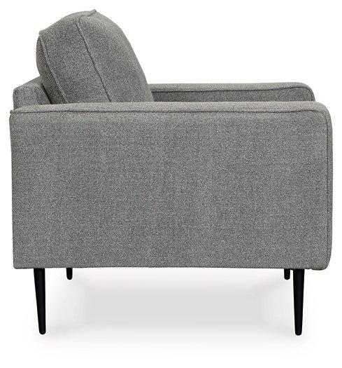 Ashley Hazela living room set with a sofa and armchair in a modern design, featuring neutral upholstery and wooden legs.