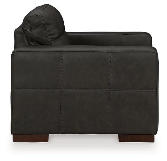 Ashley Furniture Luigi oversized chair with plush upholstery and wide armrests, perfect for comfortable seating in living rooms.