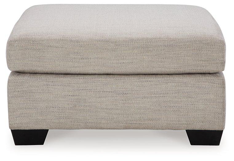 Ashley Furniture Mahoney oversized accent Ottoman with plush fabric, featuring a modern design and sturdy wooden legs.