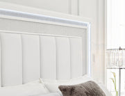 Ashley Furniture Chalanna upholstered storage bed with a padded headboard and built-in storage drawers in a modern bedroom setting.