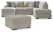 Ashley Furniture Calnita living room set featuring a sofa and loveseat with neutral upholstery and modern design.