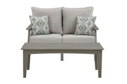 Ashley Furniture Visola outdoor loveseat and coffee table set with cushioned seating and wooden table in a backyard setting.