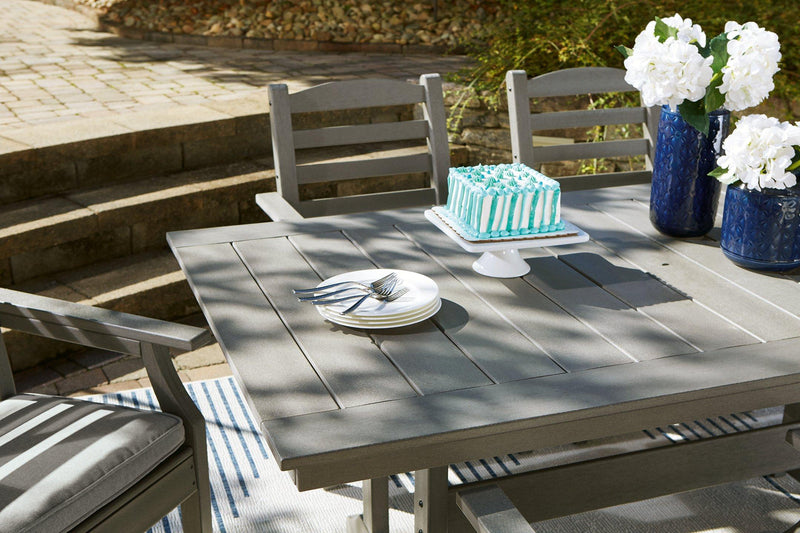Outdoor dining set with a rectangular table and four chairs by Ashley Furniture, perfect for outdoor gatherings.