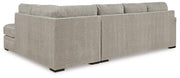 Ashley Furniture Calnita living room set with sofa, armchair, and coffee table in a modern, stylish design.