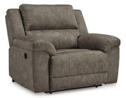 Ashley Furniture Laresview Oversized Recliner with plush fabric and padded armrests, shown in a cozy living room setting.