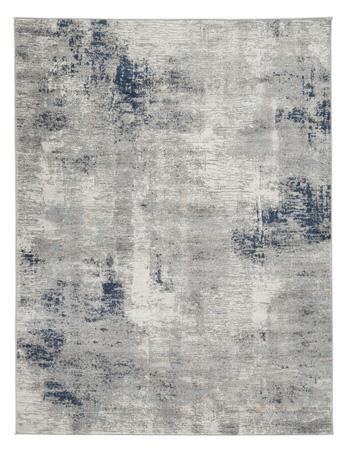 Wrenstow 7'10" x 10'3" rug by Ashley Furniture featuring a soft, patterned design in neutral tones on a hardwood floor.