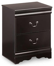 Ashley Furniture Huey Vineyard Bedroom Set with bed frame, dresser, and nightstands in a cozy bedroom setting.