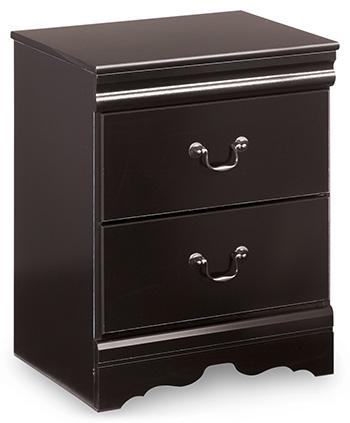 Ashley Furniture Huey Vineyard Bedroom Set with bed frame, dresser, and nightstands in a cozy bedroom setting.