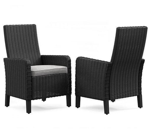 Set of two Ashley Furniture Beachcroft outdoor arm chairs with cushions, weather-resistant patio dining chairs for outdoor seating.