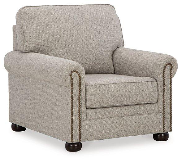 Ashley Gaelon Living Room Set featuring a sofa and armchair with neutral fabric upholstery and modern design elements.