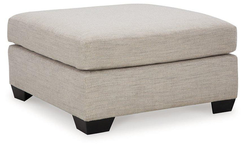 Ashley Furniture Mahoney oversized accent ottoman with plush fabric and tufted top, perfect for living room decor.