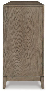 Ashley Furniture Chrestner dining server with storage drawers and cabinets, showcasing a polished wood finish and elegant design.