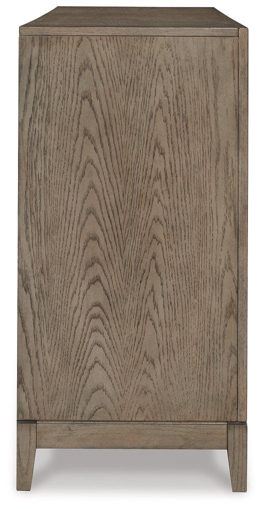Ashley Furniture Chrestner dining server with storage drawers and cabinets, showcasing a polished wood finish and elegant design.