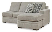 Ashley Furniture Calnita sectional with chaise, modern fabric sofa featuring plush cushions and a spacious design.
