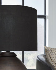 Naareman table lamp by Ashley Furniture featuring a sleek base and fabric shade, ideal for living room or bedside table lighting.