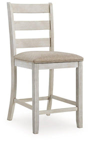 Ashley Furniture Skempton counter height dining set with barstools, featuring wooden seats and metal frames for a modern look.