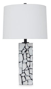 Macaria table lamp by Ashley Furniture featuring a sleek base and fabric lampshade, ideal for modern home décor.