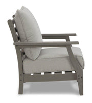 Ashley Furniture Visola outdoor loveseat and conversation set with cushioned seats and a sturdy metal frame, perfect for outdoor lounging.