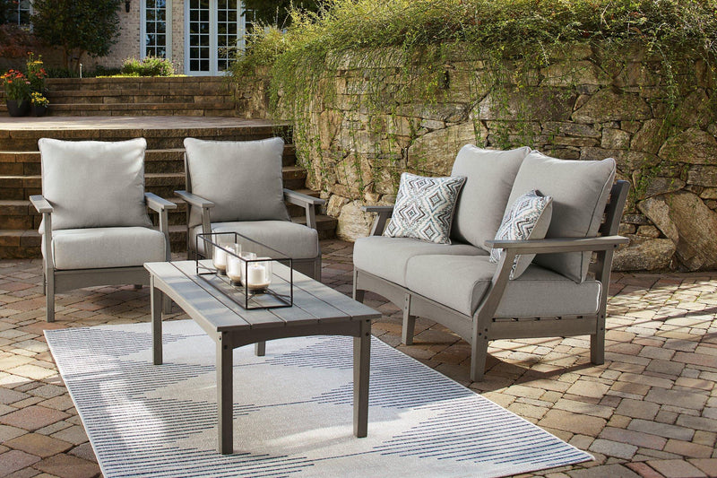 Ashley Visola outdoor loveseat conversation set with cushioned seats and a sturdy metal frame, perfect for patio relaxation.