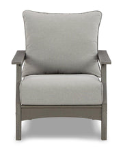 Outdoor loveseat conversation set by Ashley Furniture with cushioned seats, coffee table, and outdoor-friendly design.