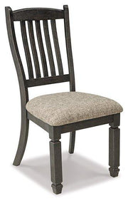 Ashley Furniture Tyler Creek dining room set featuring a wooden table and six matching chairs in a modern design.