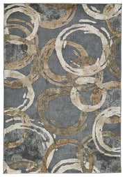 Ashley Furniture Faelyn 7'10" x 9'10" rug featuring a modern design with soft, neutral colors and a plush texture on a wooden floor.