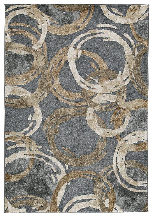 Ashley Furniture Faelyn 7'10" x 9'10" rug featuring a modern design with soft, neutral colors and a plush texture on a wooden floor.
