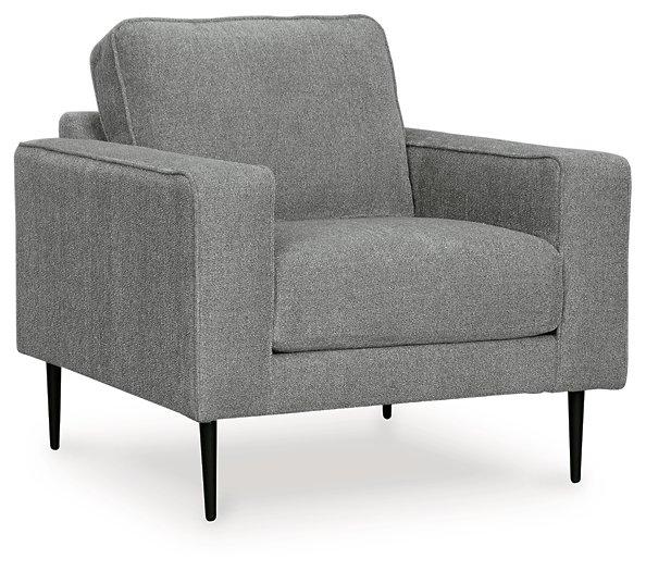 Ashley Hazela living room set with plush sofas and coordinated coffee table, showcasing modern design and neutral fabric upholstery.