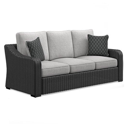 Ashley Furniture Beachcroft outdoor sofa with cushion, featuring weather-resistant design and comfortable seating for outdoor spaces.