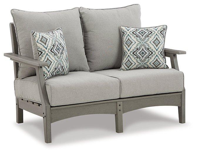 Outdoor Ashley Furniture Visola loveseat and chair set with cushions, perfect for patio conversation and relaxing outdoors.