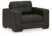 Luigi oversized chair by Ashley Furniture featuring plush fabric, wide seat, and comfortable armrests in a modern design.
