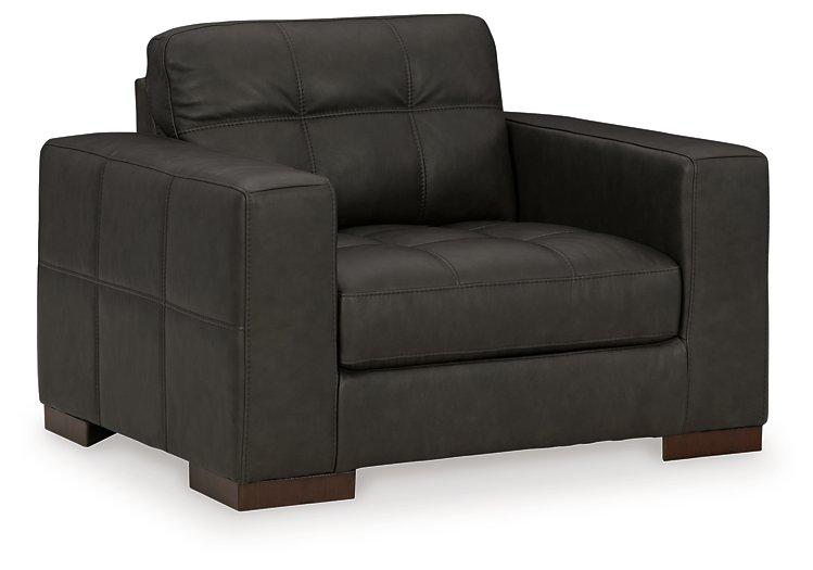 Luigi oversized chair by Ashley Furniture featuring plush fabric, wide seat, and comfortable armrests in a modern design.
