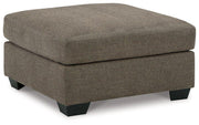 Ashley Furniture Mahoney oversized accent ottoman with plush fabric and tufted top, ideal as a stylish living room accent piece.