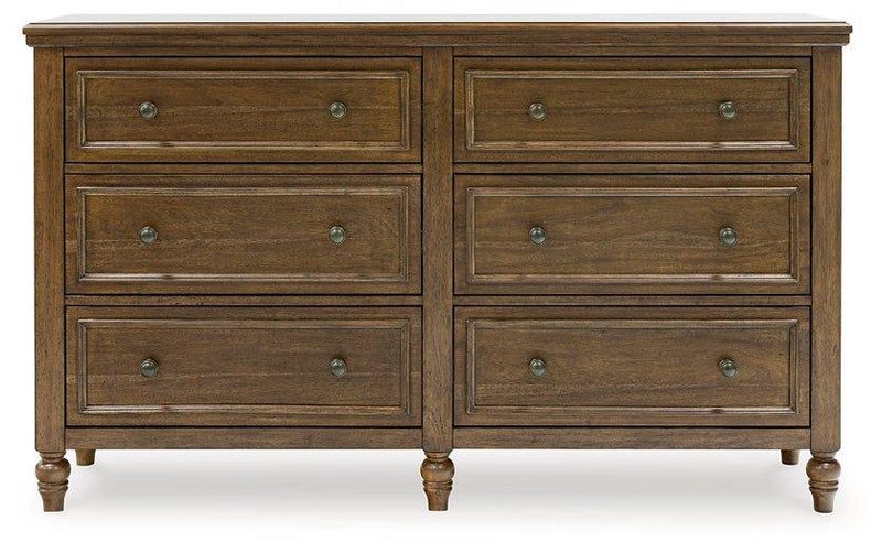 Ashley Furniture Sturlayne dresser with matching mirror, featuring a modern design and sleek wood finish.