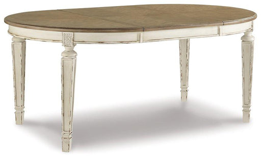 Realyn Dining Extension Table by Ashley Furniture, showing a stylish wooden dining table with extendable leaves in a modern dining room setting.