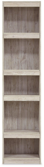 Willowton Pier media tower by Ashley Furniture featuring multiple shelves and a sleek wood finish for modern living room storage.