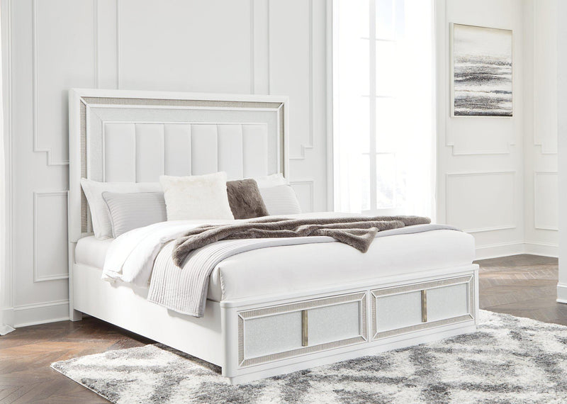 Ashley Furniture Chalanna upholstered storage bed with a neutral fabric headboard and built-in storage drawers in a modern bedroom setting.