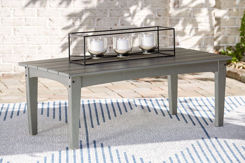 Ashley Furniture Visola outdoor loveseat and coffee table set with cushioned seating and weather-resistant design for outdoor relaxation.